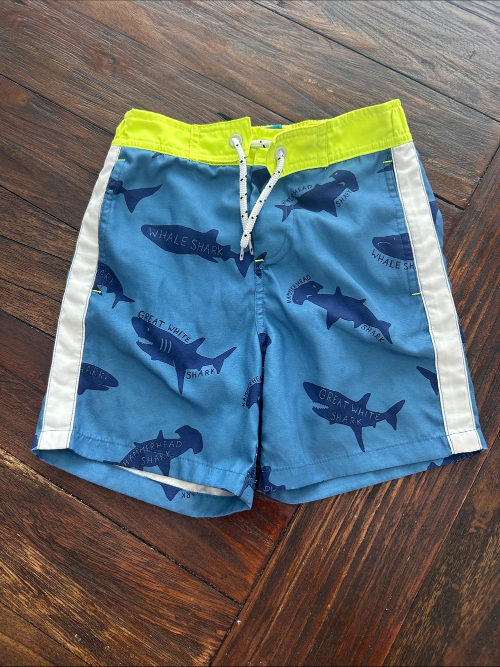 Baby Boden Blue Shark Print Swim Trunks with Neon Yellow Waistband